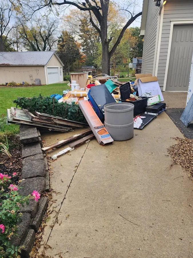 Dumpster being loaded with debris for 3 Yard Dumpster Rental in Naperville
